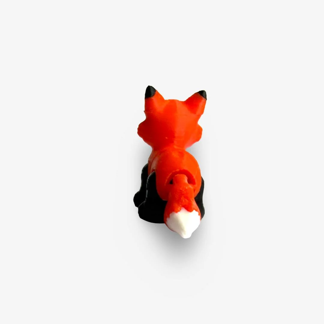 Mini 3D drukāta lapsiņa – oranža ar melniem un baltiem akcentiem