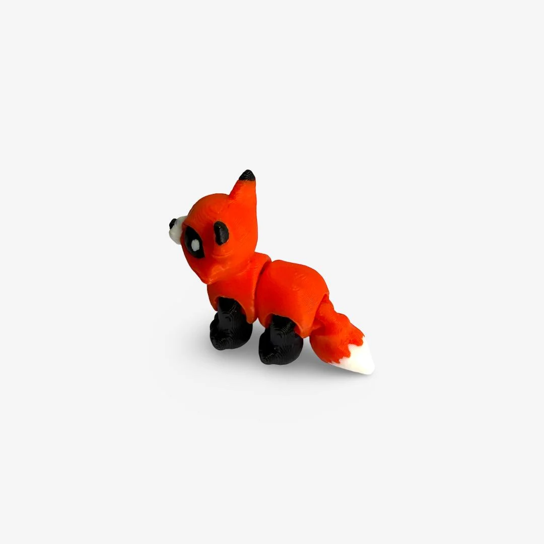 Mini 3D drukāta lapsiņa – oranža ar melniem un baltiem akcentiem